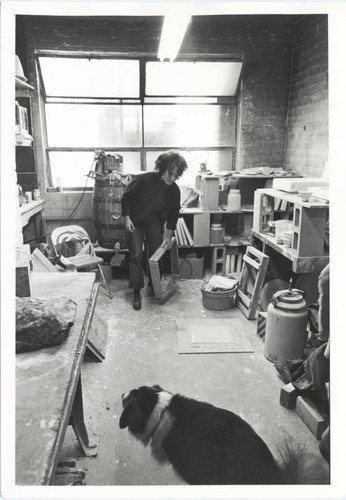 Woman in studio with dog, Scripps College