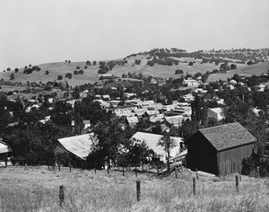 View overlooking the town Sutter's Creek, showing the hills in the distance, ca.1930