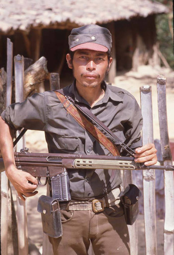 Guerrillero standing with his rifle, La Palma, 1983