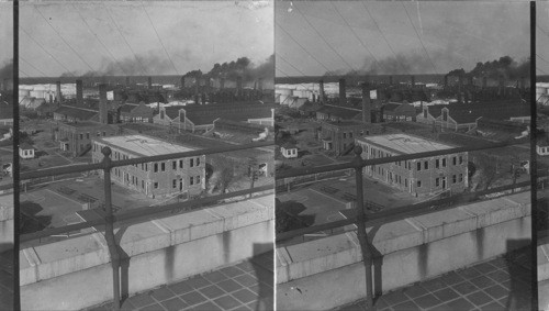 North east over Magnolia Petroleum Co. Beaumont, Texas, boiler shops, machine shops & blacksmith shops, at right in foreground, and at right in background is crude oil stills, and acid works. In center the round tanks are the oil agitators. Back of them crude oil tower stills. At storage tanks, at left foreground the power plant