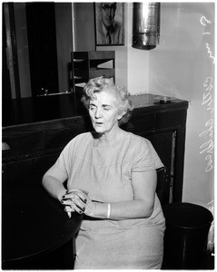 Suspicion of stabbing her husband, 1957