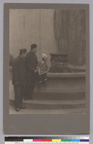 [Chinatown: two men and girl at fountain]