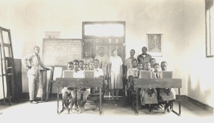 Children and teachers inside classroom, Zambia, 1928
