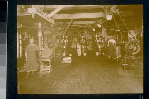 [Factory workers and machinery.]