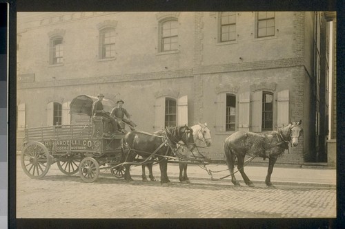 [D. Ghirardelli Company horse wagon outside factory.]