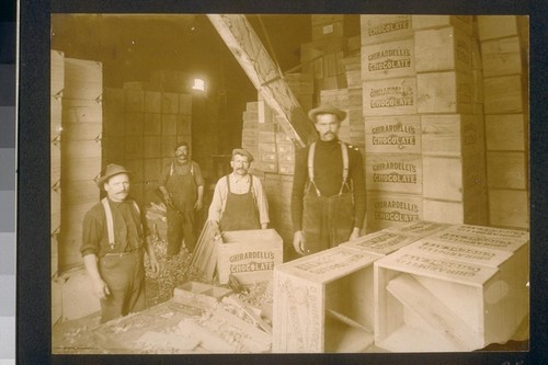 [Factory workers in packaging area.]