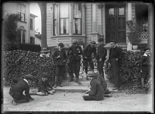 Oliver boys, and others, playing marbles. [negative]
