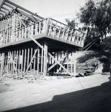 Construction of a house, on the back it indicates that this part of the house is "garage, bedroom and sundeck" (Spencer Chan Family)