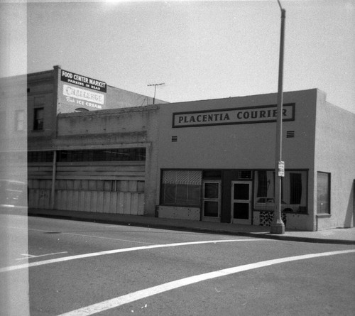 Photograph of Placentia Courier office and Food Market Center on Santa Fe Ave
