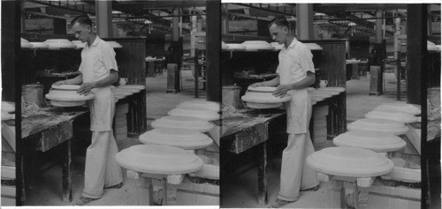 Placing the "foot" (bottom rim) in proper position on a platter, "Lenox Inc.," makers of fine china ware, Trenton, Trenton, N.J