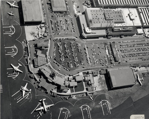 Lockheed Air Terminal Complex showing United's DC-3's & the DC-4 in Spot 2, parking lot, Lockheed Plant A-1, Hangar 1, Hangar 2, aerial view. ca 1950