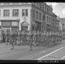 Group of women in uniform marching in a parade