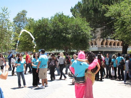 Belly dancers giving lessons on the Ring Mall during "iFest" celebration; photograph at University of California, Irvine