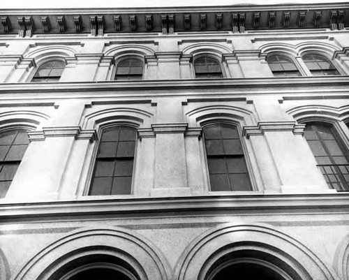 Facade of the Pico House looking up sides of the building's arches