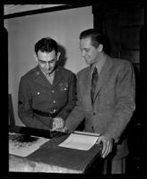 William Holden submits finger prints during enlistment, Los Angeles, 1942
