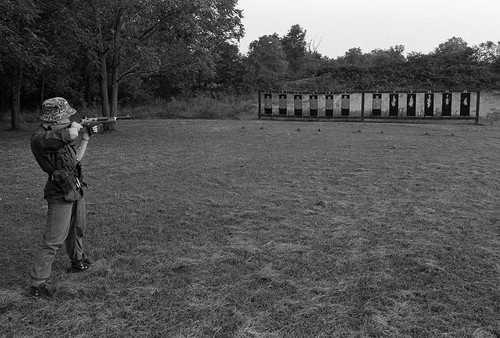 Survival school student shoots targets, Liberal, 1982