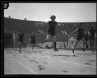 Lillian Copeland crossing the finish line in a race at the Coliseum, Los Angeles, circa 1924-1932