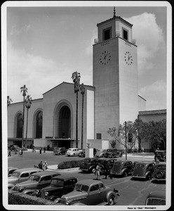 Union Station as seen from its parking lot, with people walking to their cars