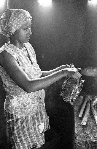 Anselma Salas cooking a turtle, San Basilio de Palenque, 1977