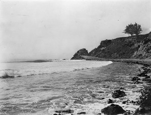 View of waves crashing on an unidentified beach