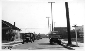 Looking easterly on 36th Street from San Pedro Street showing practice of storing old worn out trucks along curb, Los Angeles, 1928
