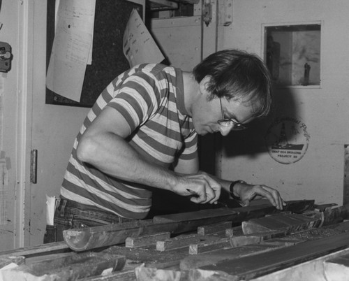 Scientist Kevin Pickering is working on some drilling cores aboard the D/V Glomar Challenger (ship) taken during Leg 96 of the Deep Sea Drilling Project. 1983