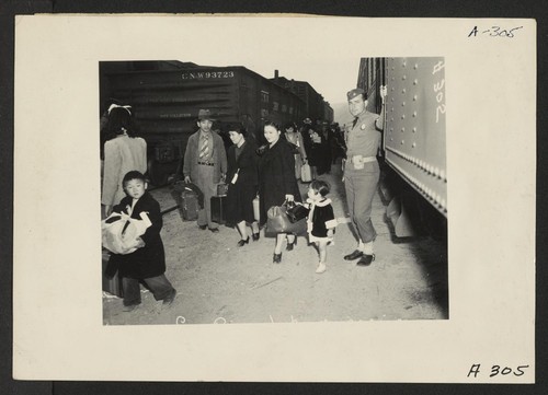 Lone Pine, Calif.--Evacuees of Japanese ancestry arrive here by train prior to being transferred by bus to Manzanar, now a War Relocation Authority center. Photographer: Albers, Clem Lone Pine, California