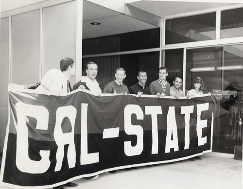 Students holding up a banner which reads "CAL-STATE"
