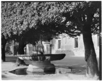 Shallow fountain in a shady courtyard in Rome, Italy, 1929