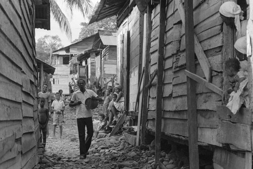A man and his drum in an alley, Barbacoas, Colombia, 1979