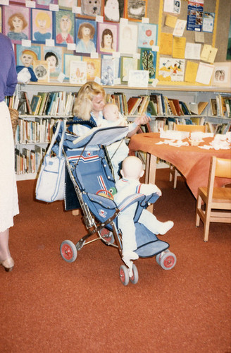 Mother Reading to Child in the Children's Room