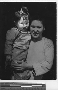 A tattooed child with her mother at Fushun, China, 1938