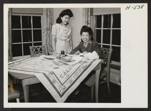 Miss Julie Sugimoto (left) and her sister, June (right), work in the home of the Burchette family in Peoria, Illinois