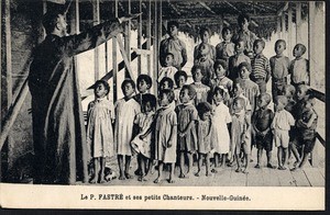 Missionary father directs a group of children in song, Papua New Guinea, ca.1900-1930