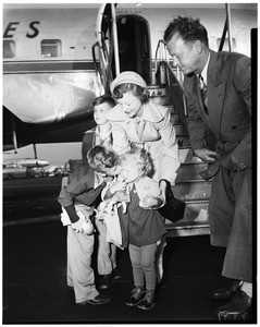 German baby arrives, Los Angeles International Airport, to be adopted by Craigs, 1952