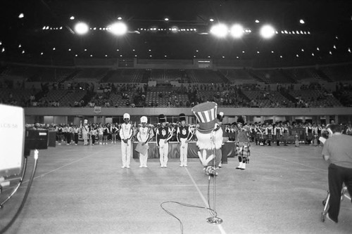 High School marching bands standing at attention at a LAUSD Band and Drill Team Championship, Los Angeles, 1983