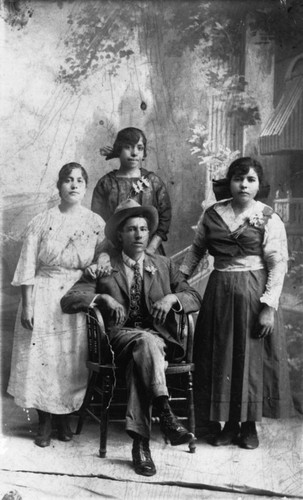 Maria, Apolinar and Dolores Estrada with Victoria Marquez [graphic]