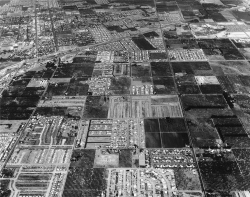 Aerial View of Anaheim, Including Disneyland and Santa Ana Freeway. [graphic]