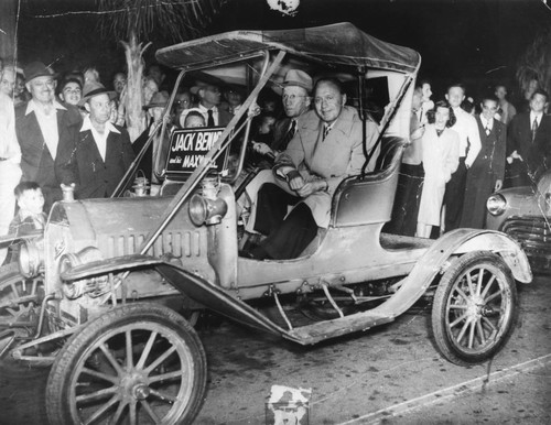 Jack Benny riding in 1906 Maxwell Automobile in Anaheim Civic Progress Week Parade. [graphic]