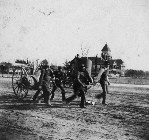 Anaheim Volunteer Fire Department Pulling Hand-Drawn Fire Truck [graphic]