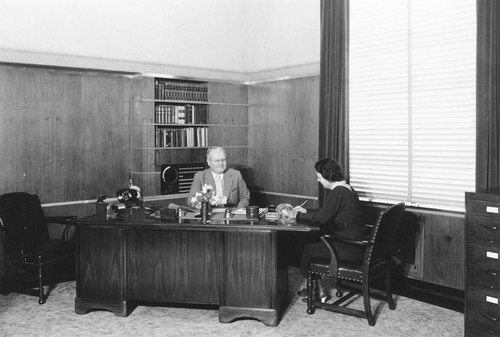 Principal Joseph Clayes and Secretary Dorothy Peck, Anaheim Union High School Office. [graphic]