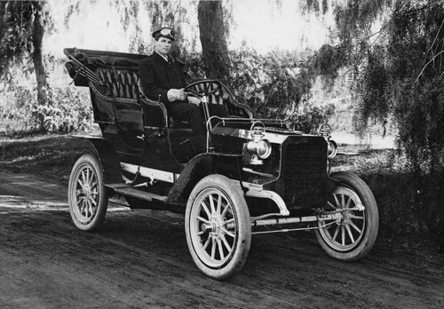 Theodore E. Dickel seated in a 1904 REO Automobile, Anaheim [graphic]