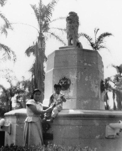 Tony Soriano, Jr. and Mother at Lions Club Fountain, Anaheim City Park [graphic]