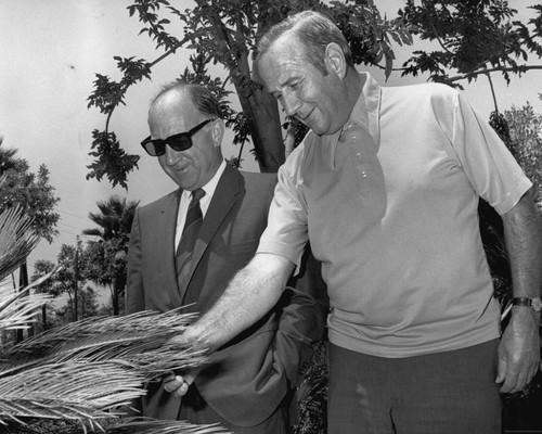 Thornton Piersall, Anaheim Public Works Director (1961-1980) and Ron Woll, Parkway Maintenance Superintendent. [graphic]