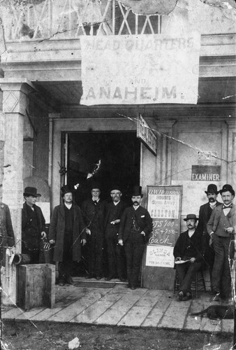 Group of Men in Front of Real Estate Office, Anaheim [graphic]