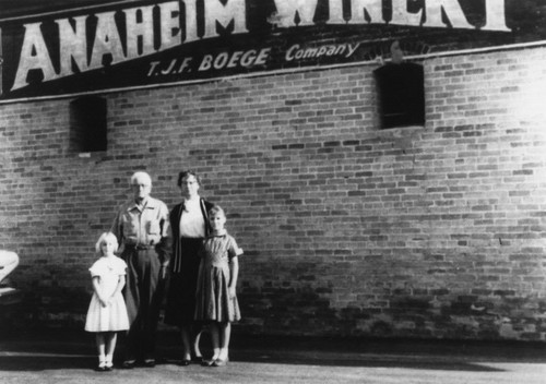 Boege Family Standing Beneath Anaheim Winery Sign [graphic]