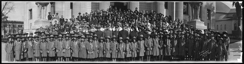 Group portrait of children and adult members of the Salvation Army