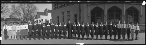 Father Collins with students at St. Joseph's School