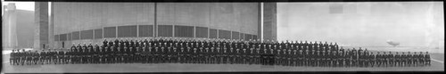 Naval officers and sailors at Moffett Field hangar