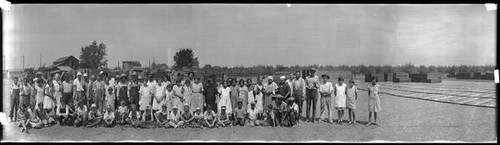 Portrait of laborers at fruit drying yard